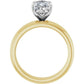 Profile view of a yellow gold solitaire engagement ring with a raised silver-tone prong setting