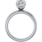 Profile view of a platinum solitaire engagement ring with a raised prong setting